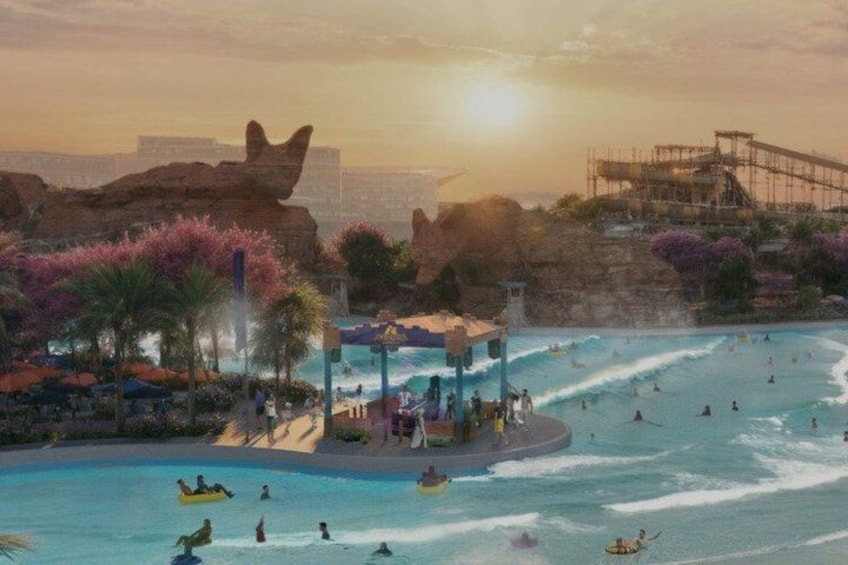 Ein Wasserpark mit Wellenbad, Palmen und Sonnenuntergang. 1