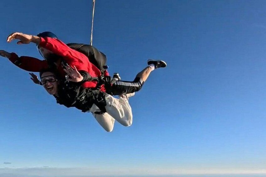 Two people bungee jumping with harnesses. 4