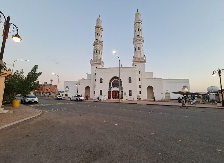 A mosque with two minarets and a large central dome. 1