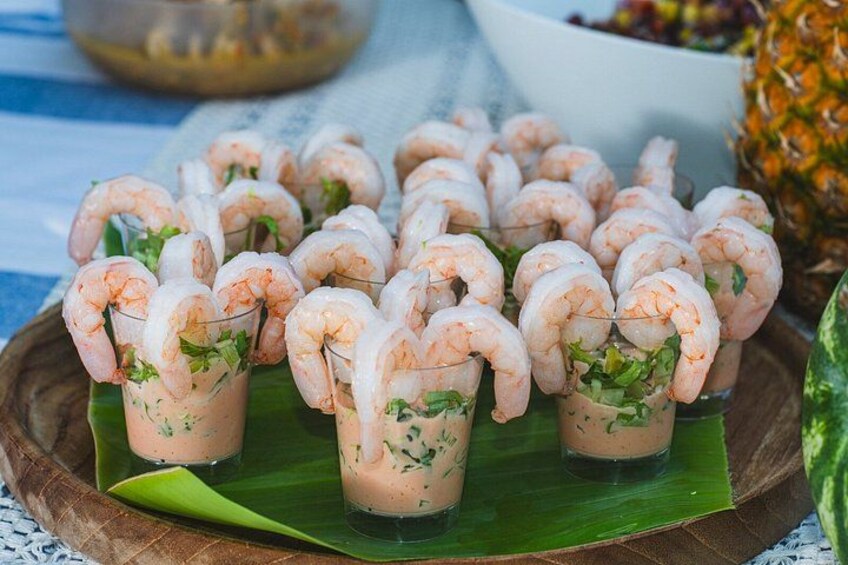 Shrimp cocktails in glasses with a green leaf base. 4
