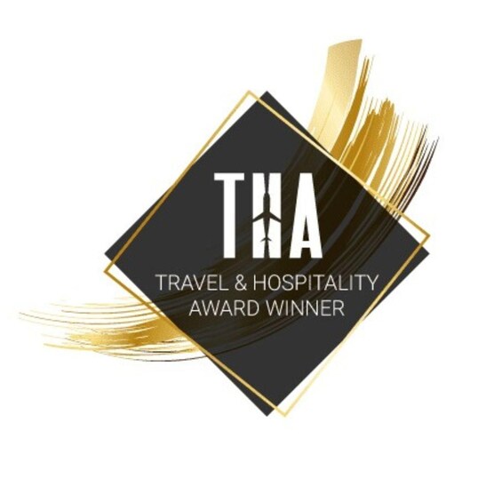 A logo with 'THA' and 'TRAVEL & HOSPITALITY AWARD WINNER' text. 5