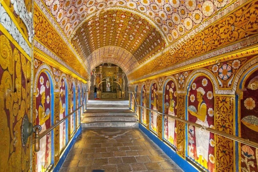 A grand, ornately decorated corridor with intricate floral patterns on the walls and ceiling, leading to a central area with a statue. 4