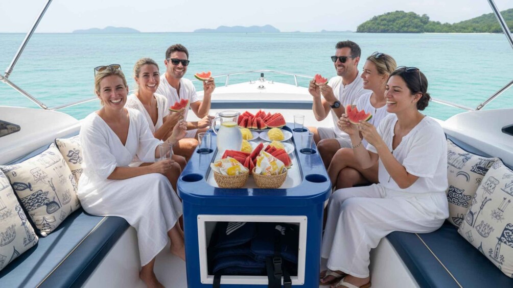 A group of people on a boat with a table set with food and drinks. 3