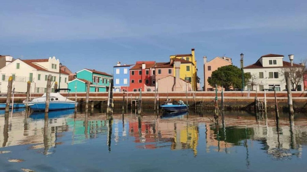 A waterfront with colorful buildings and boats docked. 5