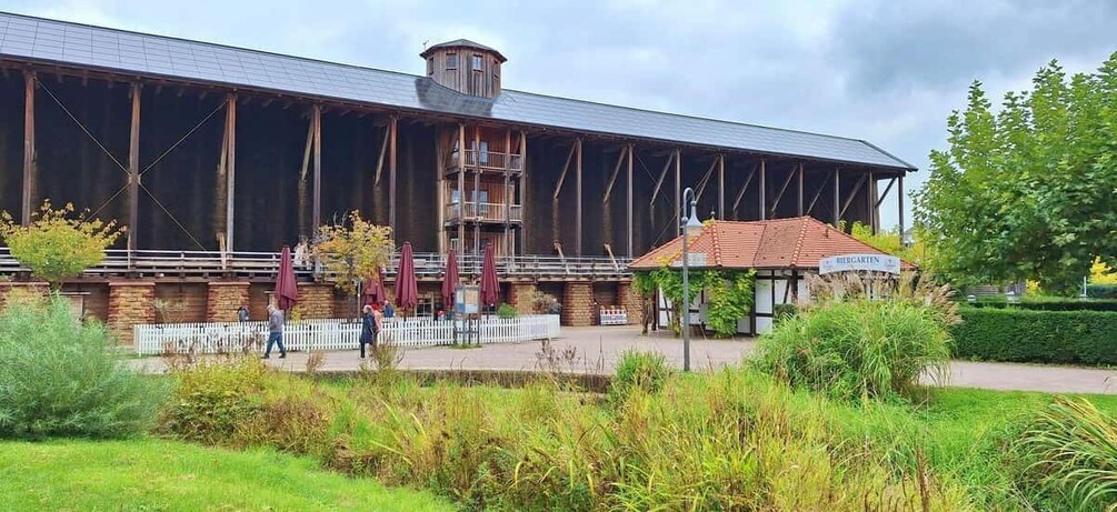 A large wooden building with a sign reading 'HERGARTEN.' 5