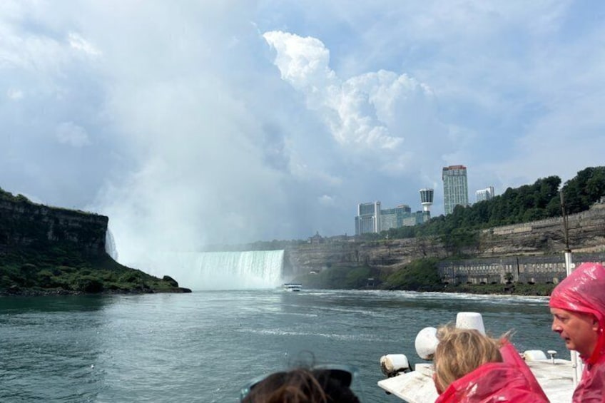 A large waterfall, a river, and a city skyline in the background. 1