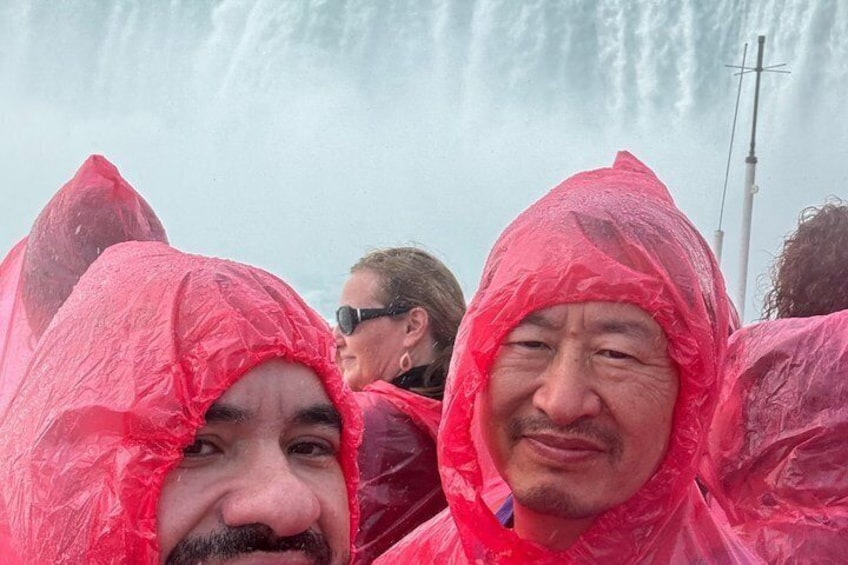A group of people wearing red rain ponchos. 2