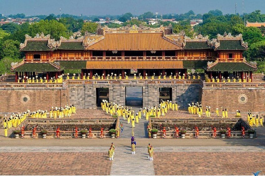 A traditional Chinese building with multiple tiers and a large courtyard. 4