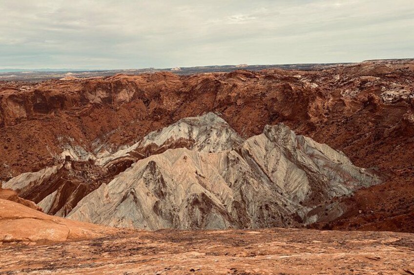 A rugged landscape with a prominent rocky mountain range. 5