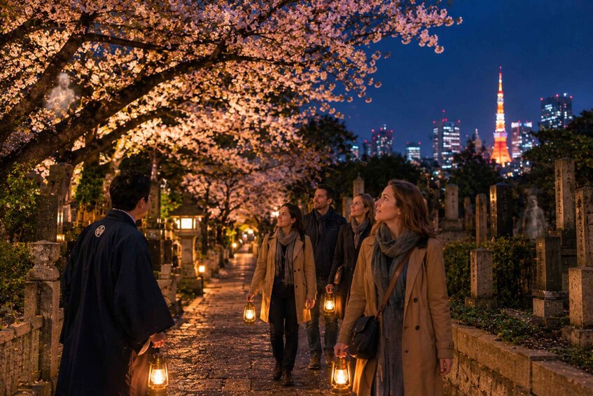 A group of people walking along a path lined with cherry blossoms at night, with a cityscape and a tall tower in the background. 1