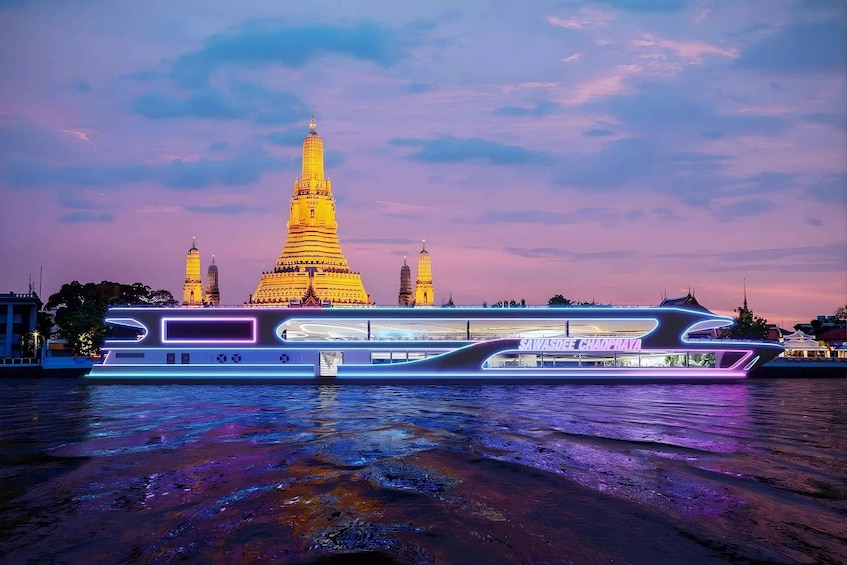 A riverboat with neon lights in front of a temple with a tall spire. 5