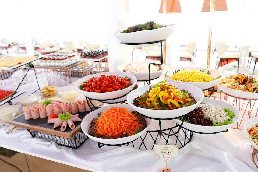 A buffet with various dishes including salads, rice, and vegetables. 4