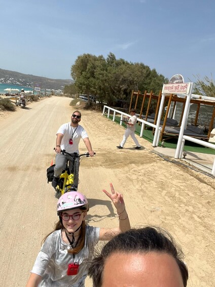 A dirt road with a beach and a sign that reads "Pool 168 Aegean". 5
