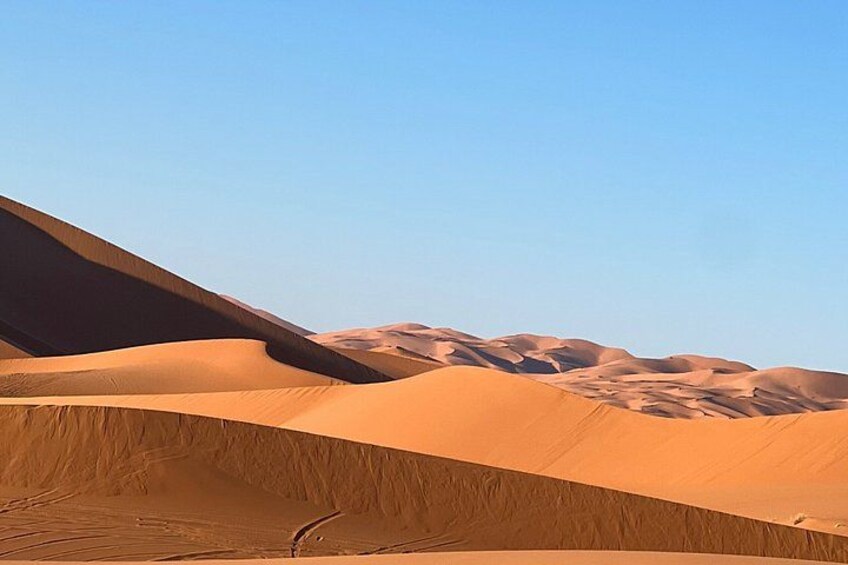 Sand dunes under a clear sky. 3