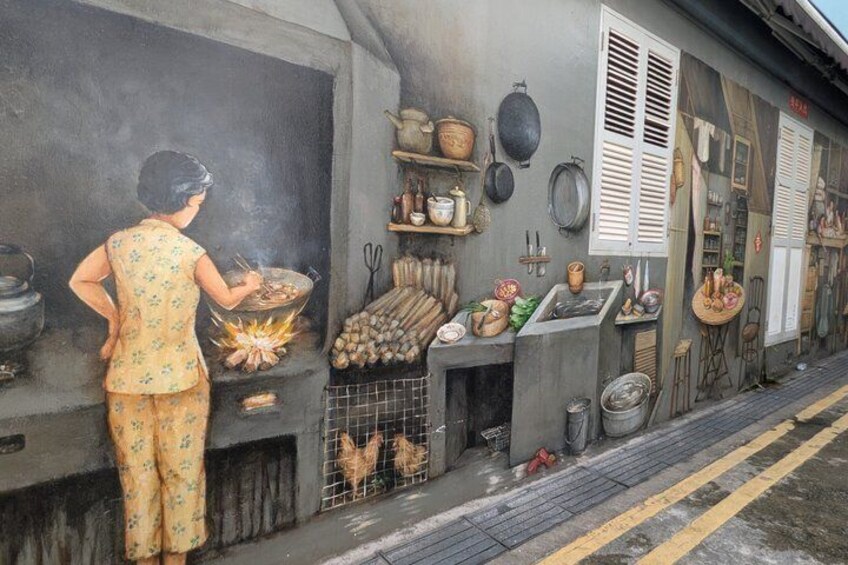 A mural of a woman cooking outdoors, with kitchen utensils and chickens visible. 1
