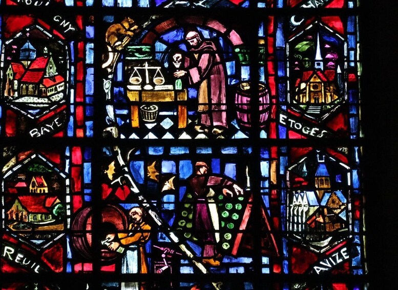 A stained glass window with geometric patterns and inscriptions. 5
