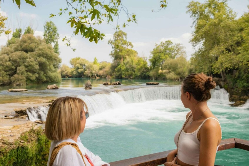 A waterfall, a river, and a forested area. 2