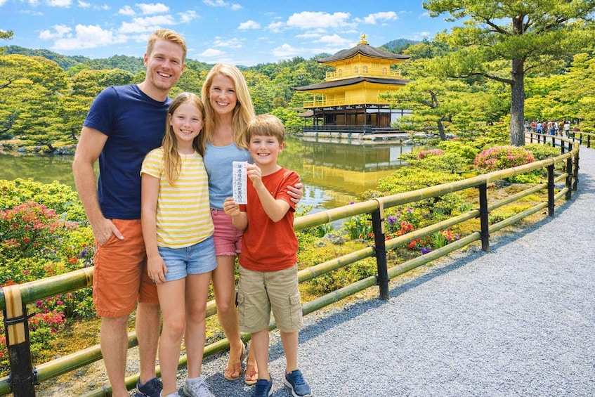 A family standing by a pond with a traditional building in the background. 5