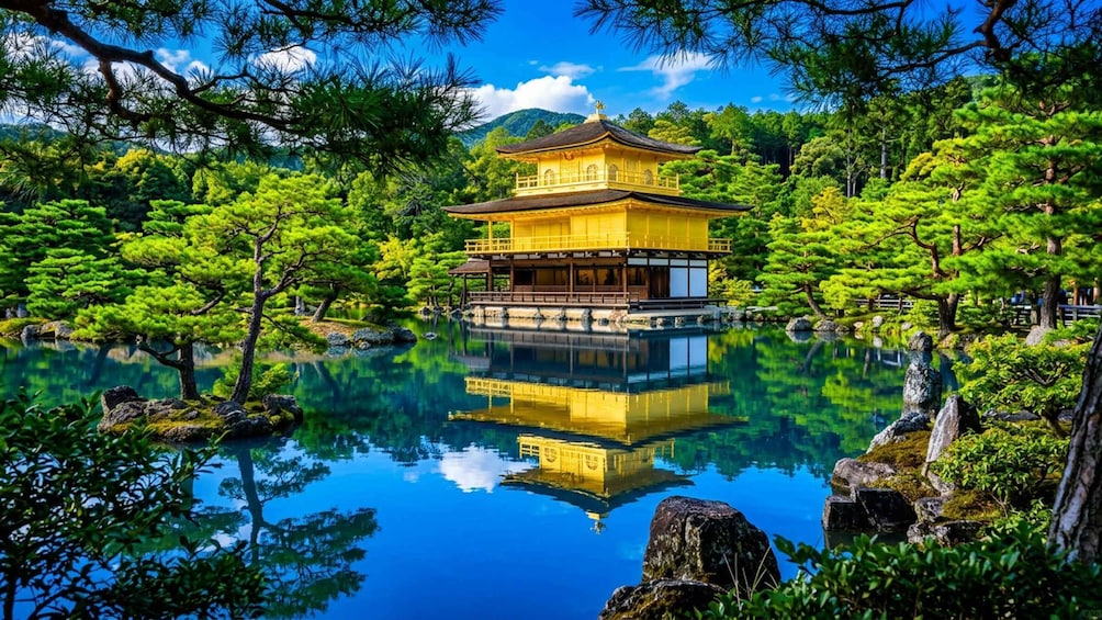 A traditional Japanese pagoda surrounded by lush greenery and a calm pond. 3