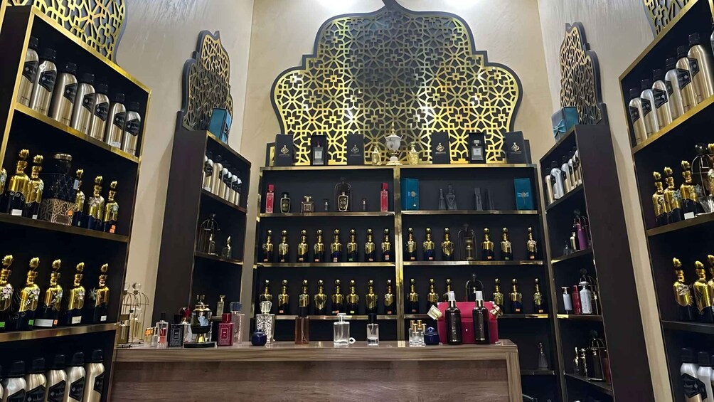 A luxury perfume store with ornate wall decorations and shelves of various perfume bottles. 3