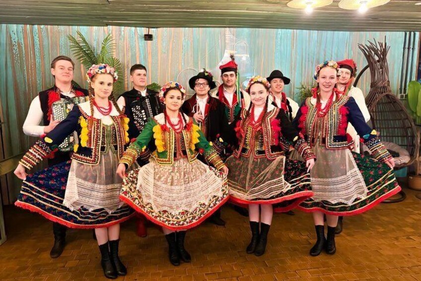 A group of people in traditional costumes. 2
