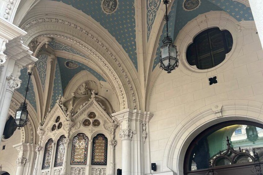 Ornate architectural details with arched windows and a dome ceiling. 3