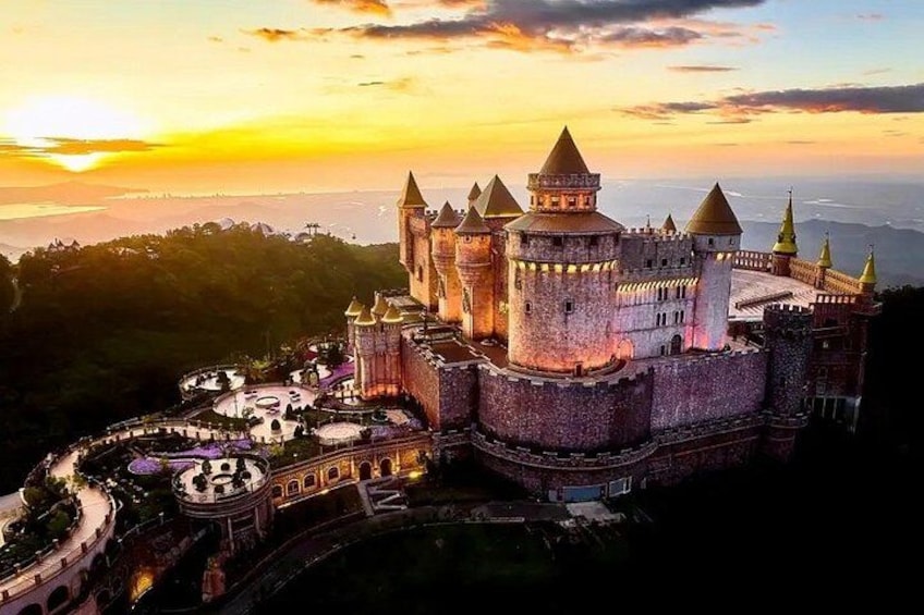 A castle with multiple towers and a moat. 2