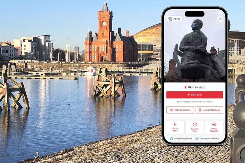 A smartphone displaying a map application with a view of a riverside cityscape, including a prominent red building with a clock tower. 1