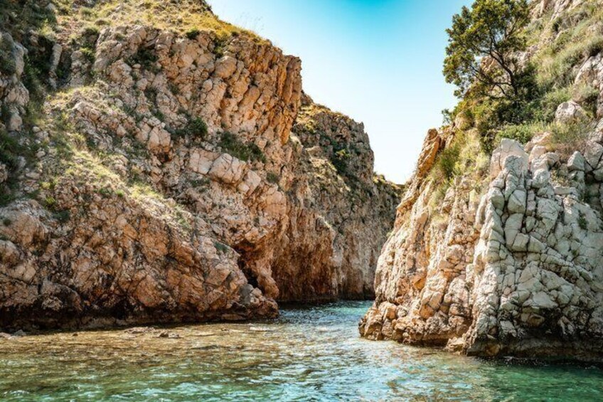 A rocky canyon with a clear river. 5