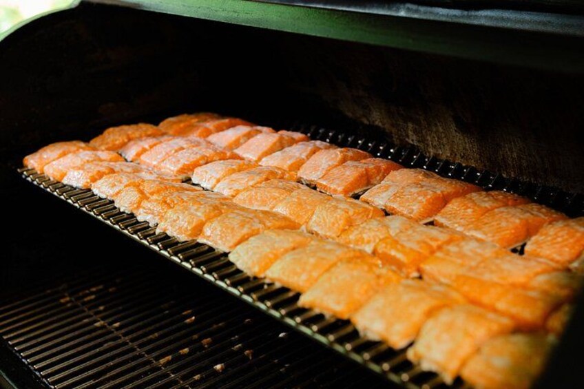 Salmon fillets being grilled on a grill. 2
