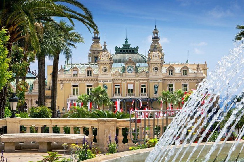 A historic building with a fountain in the foreground. 5