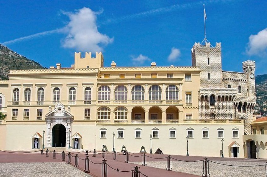 A historic building with a prominent tower, arched windows, and a central entrance. 4