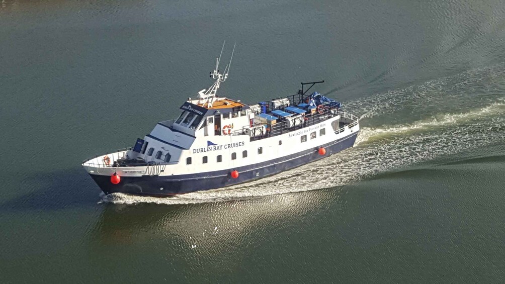 A boat named 'Dublin Bay Cruises' moving through water. 1