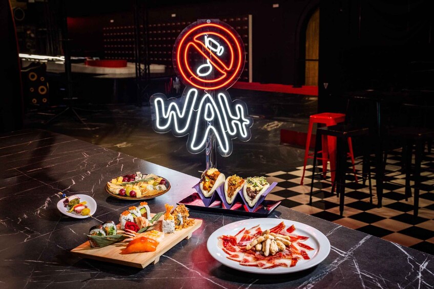 A restaurant with a neon sign reading 'Walt' and a 'No Smoking' sign above it. 3