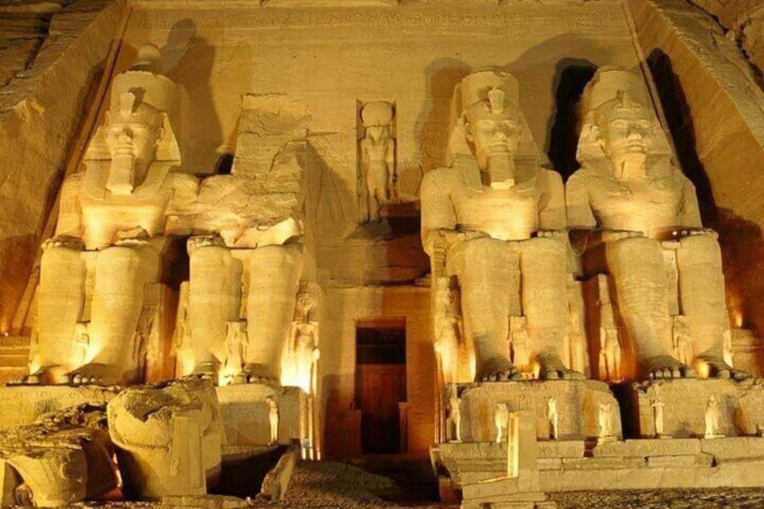 A grand temple with large seated statues. 5
