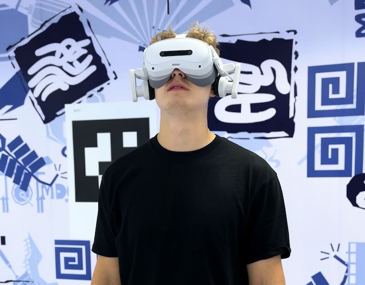 A person wearing a VR headset. 4