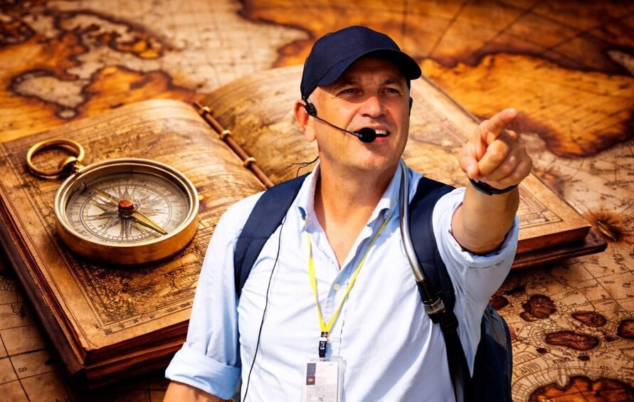 A person pointing at a compass and map, suggesting navigation or exploration. 1