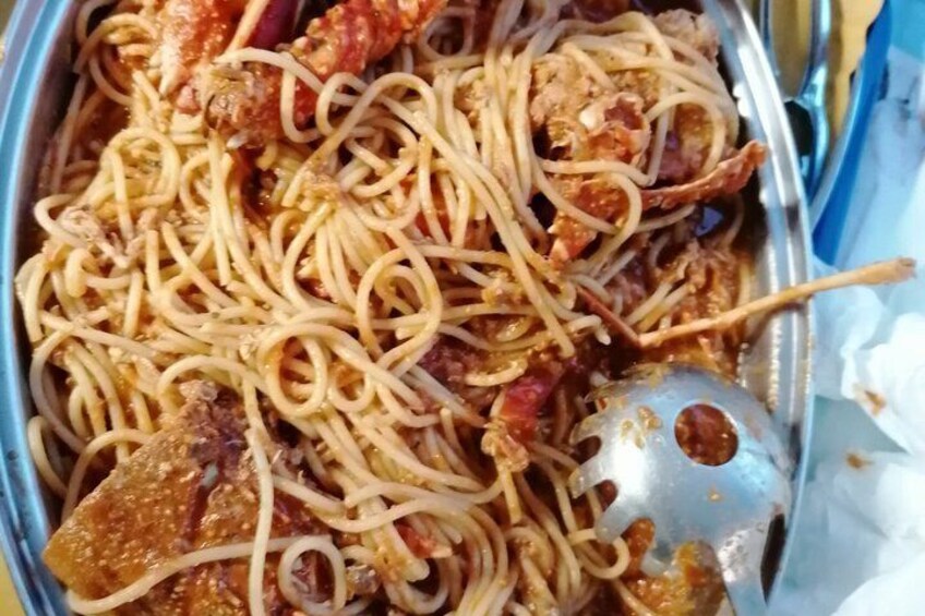 A tray of spaghetti with meat sauce. 2