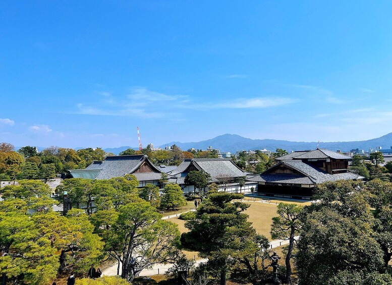 Traditional Japanese buildings with a mountain in the background. 3
