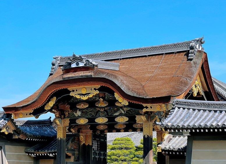 A traditional building with ornate roof tiles and intricate golden patterns. 5