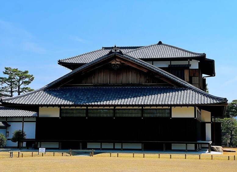 A traditional Japanese building with a tiled roof and wooden structure. 4