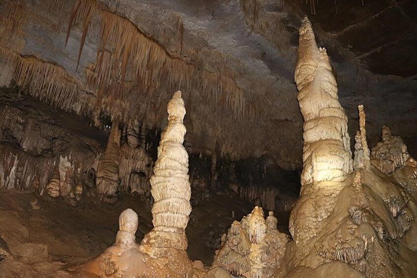 A cave with stalactites and stalagmites. 3