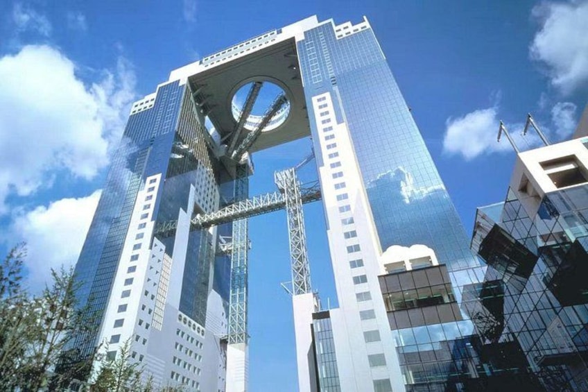 A modern skyscraper with a circular skylight and a large, open atrium. 1