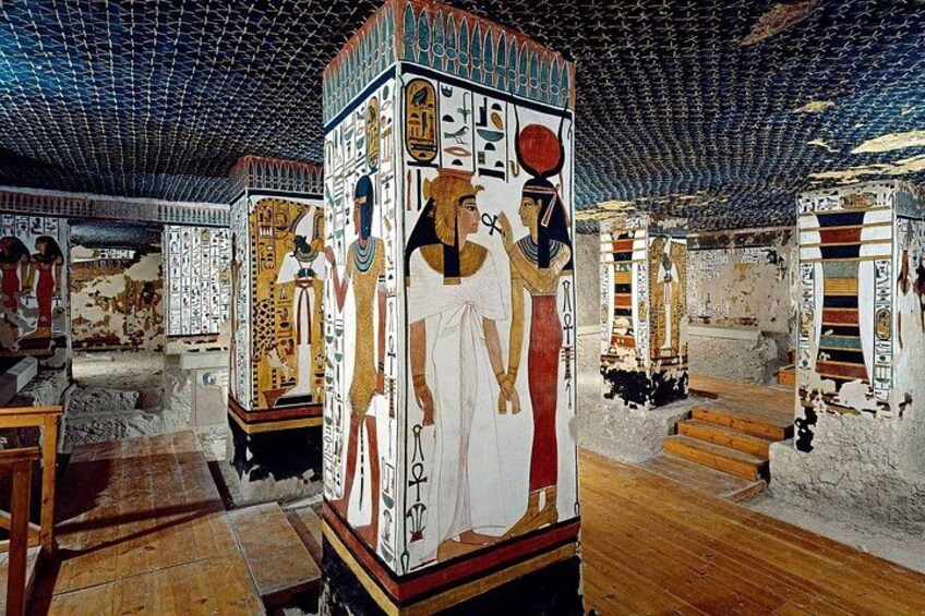 An ancient Egyptian tomb with hieroglyphics and wall paintings. 3