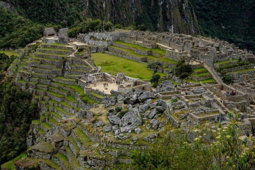 An ancient Incan city with terraced structures and stone buildings. 5