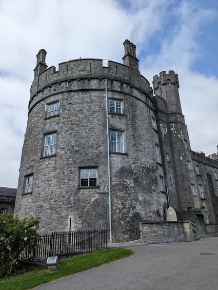 A historic stone castle with multiple towers and windows. 2