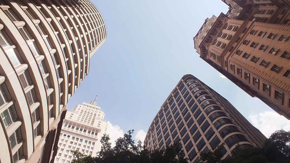 A view of tall buildings with a clear sky. 4