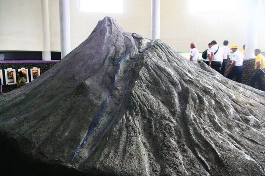 A large volcanic model with a blue line indicating a crack. 5