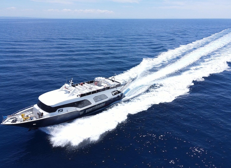 A large yacht cruising on a calm sea with a wake trailing behind it. 2