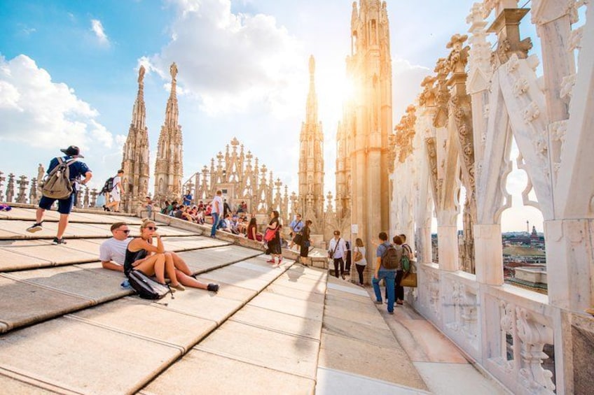 A cathedral with intricate architecture and a crowd of people. 1